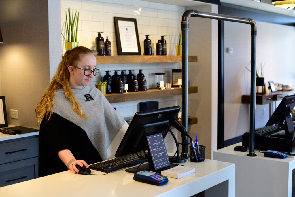 Front desk employee using a CBS POS system